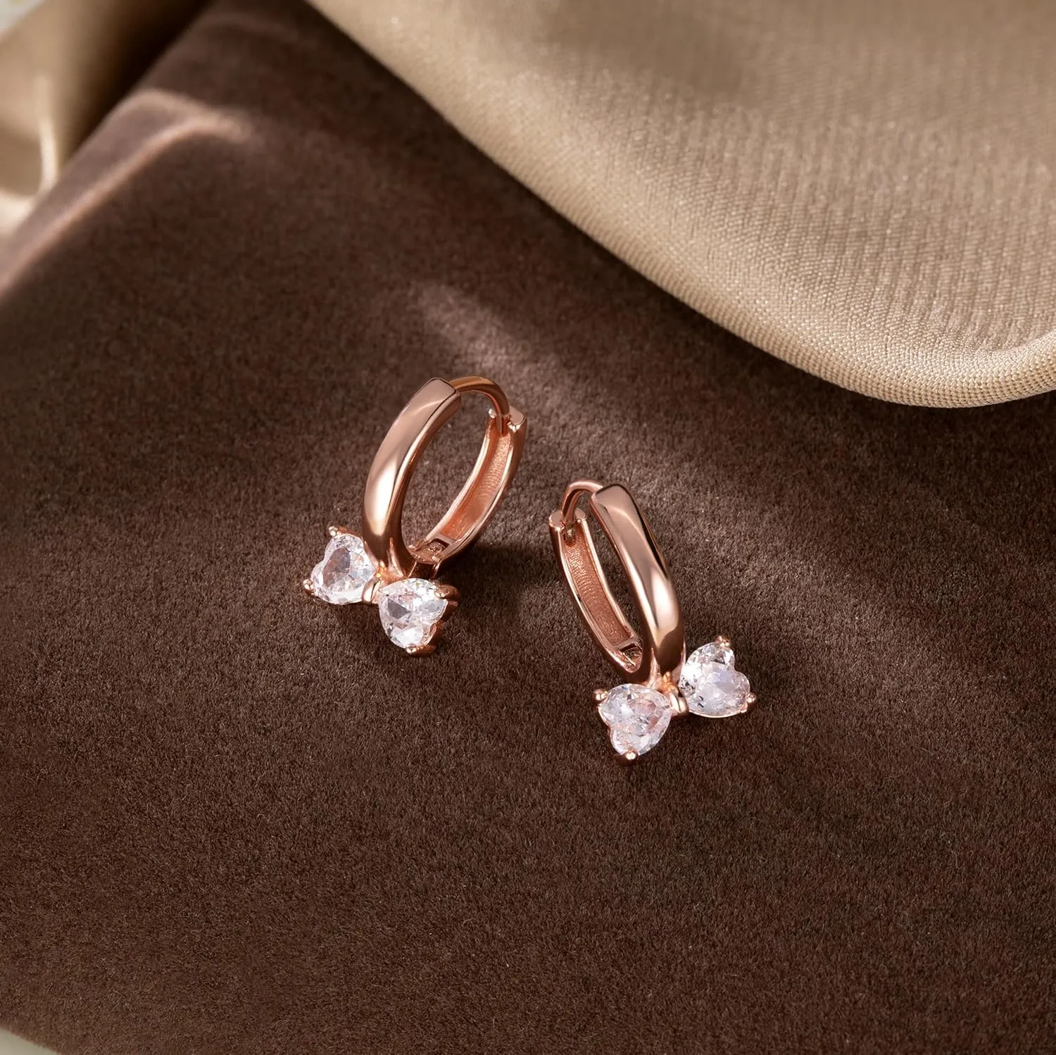 SLUYNZ Sterling Silver Love Bow Hoop Earrings for Women Teens CZ Bow Hoop Earrings Huggie